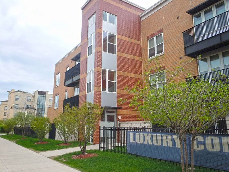 Front of Very Lovely Luxury Brick Condo
