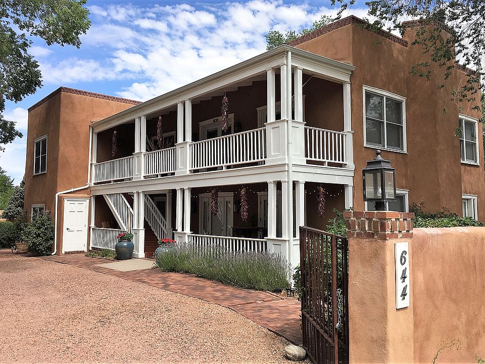 Secluded three-unit compound. Unit #B is the two-story apartment in the back.