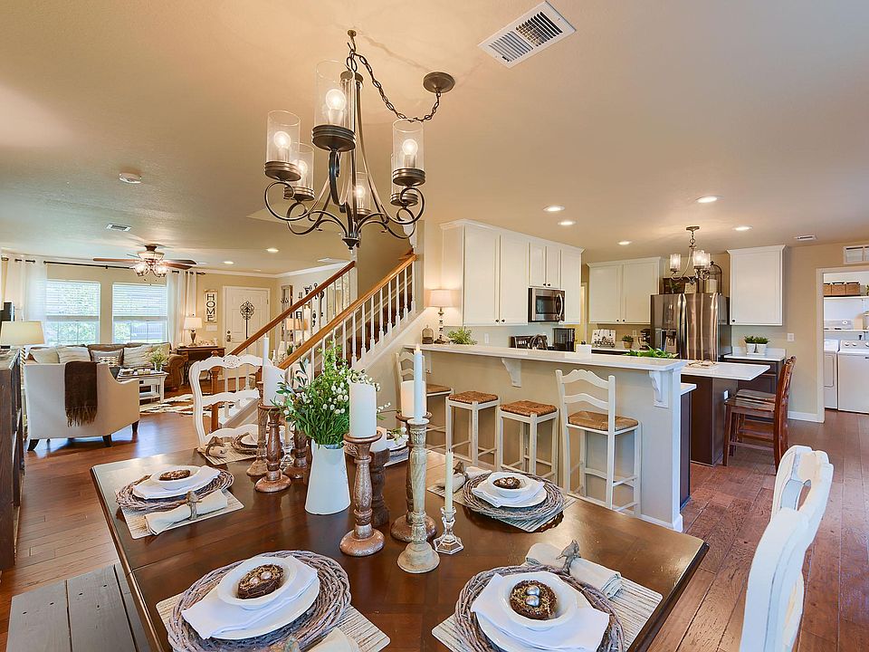 Large Dining room with updated lighting and wood floors