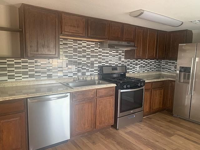 The stove is gas. Plenty of cabinets.