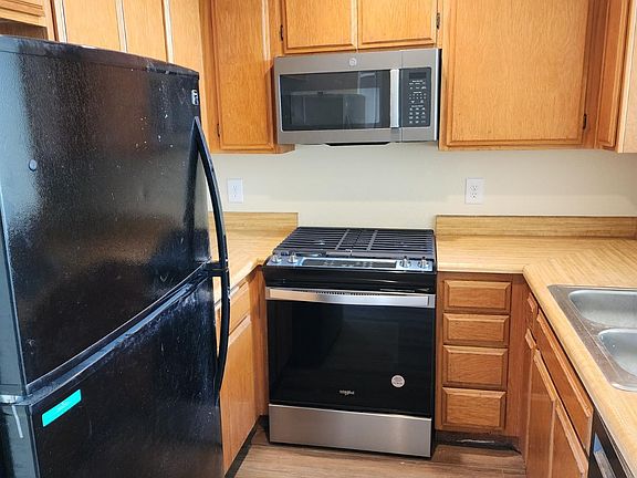 Kitchen with New Stove/Oven & Microwave, Dishwasher and Refrigerator. LED Ceiling Lights