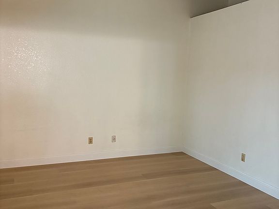 Master suite with high vaulted ceilings.