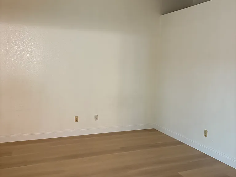 Master suite with high vaulted ceilings.
