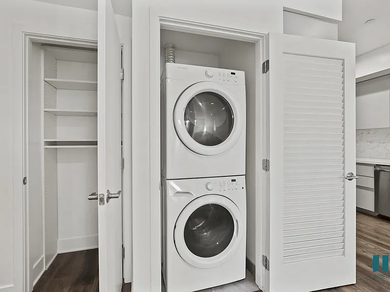 In-Suite Washer & Dryer and Hall Closet with Built-In Shelving