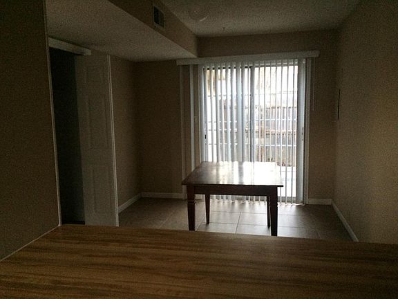 Large dining room with utility closet with washer and dryer