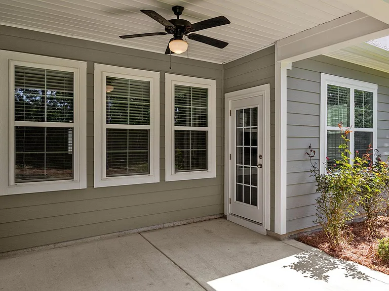Covered porch with living room access.
PLEASE NOTE - THIS PATIO IS NOW COMPLETELY SCREENED IN.