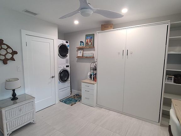 Second bedroom: Pull down Queen wall bed, full desk/office area and washer and dryer