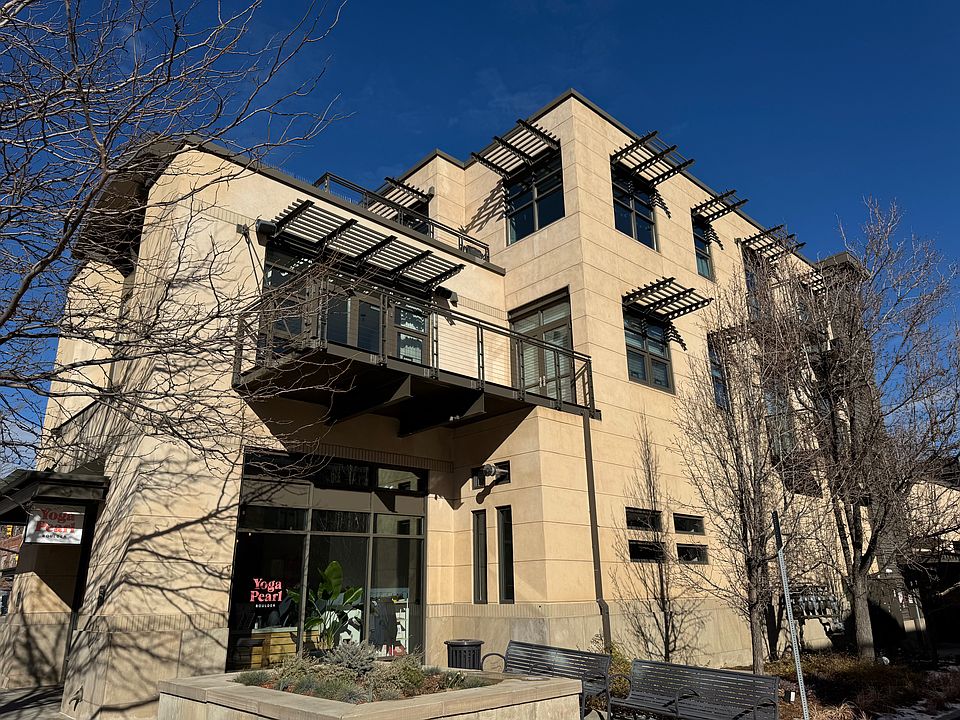 900 Pearl building view from the south. Unit 201 has the balcony and is above Pearl Yoga.