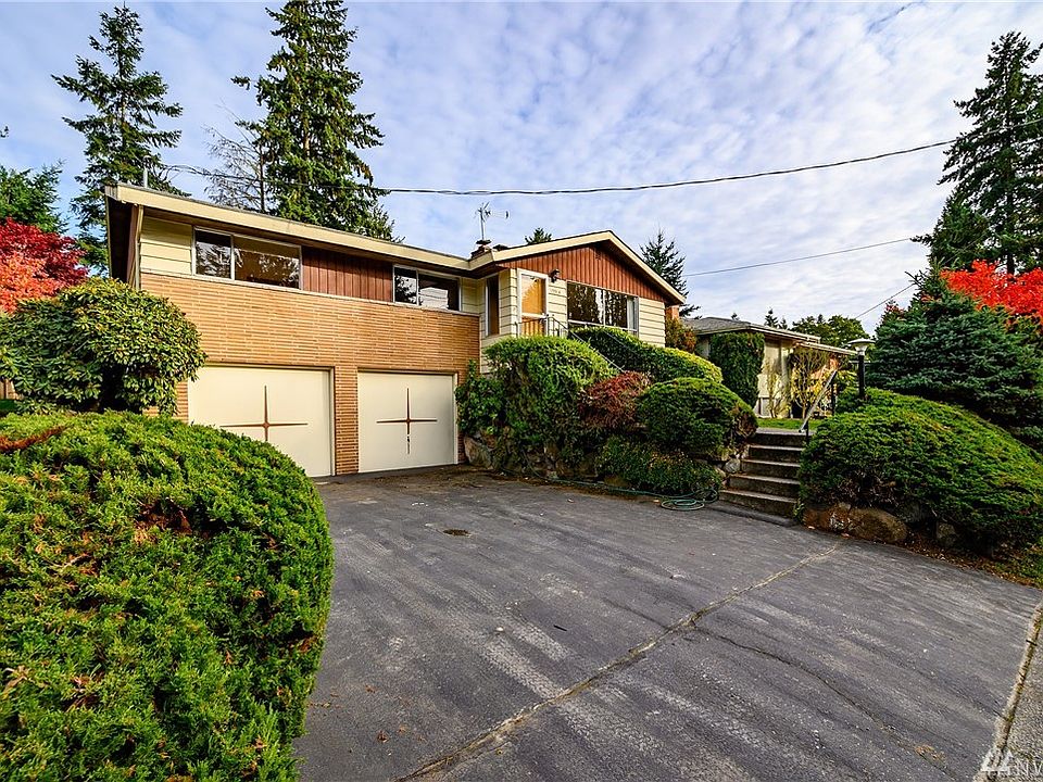 Conveniently located within close proximity to Lake City Way's amenities and eateries, this lovely mid-century gem presents an ideal opportunity for your creative inspiration. First time on the market since its owners purchased in 1960, the home offers a perfect combination of mid-century charm and room for updating to achieve contemporary panache. Let your imagination take charge!