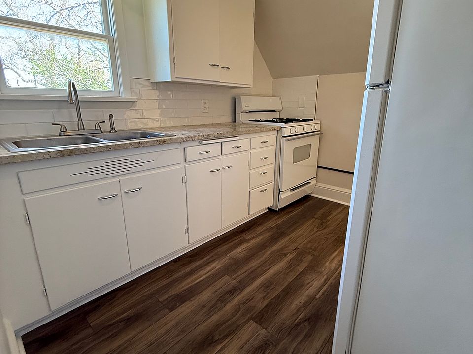 Renovated and charming kitchen with subway back splash LVP floor and all new paint.