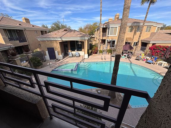 Overlooking pool, patio access from living room and master bedroom