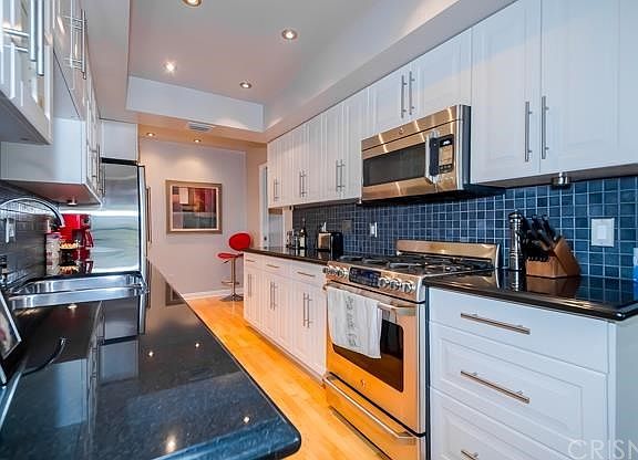 Beautiful kitchen. Hand tiled.