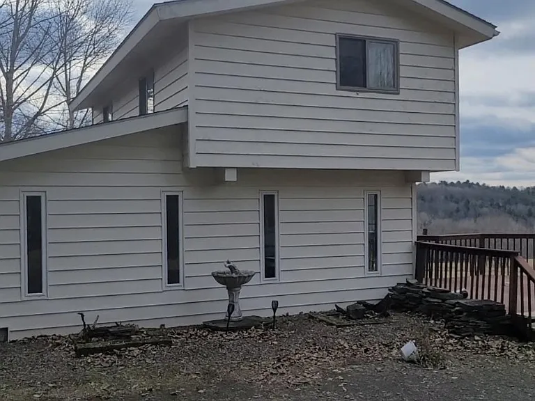 Four car parking by the house