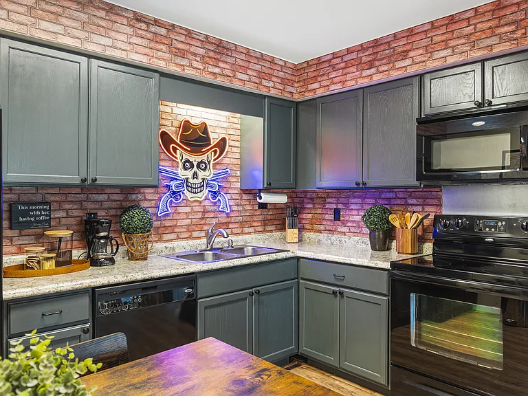 Fully equipped kitchen for all of your cooking needs! Dining table with seating for 4.