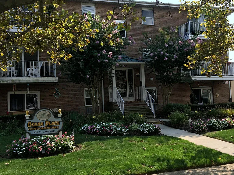beautiful manicured building with security enterance system