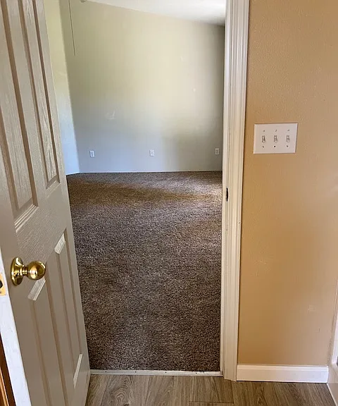 Photo looking from master bath to master bed