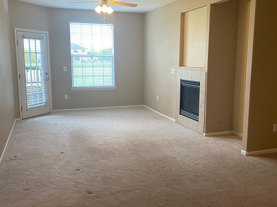 Open Living Room/Dining Room/Kitchen with door to balcony and golf course views!