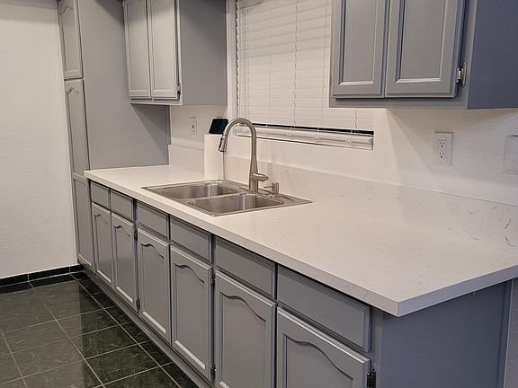 Updated hardware and quartz countertops