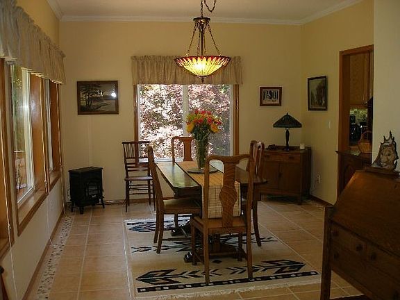 Dining room w/ new tile floors, trim and paint