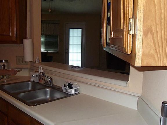 Kitchen overlook breakfast bar into Den