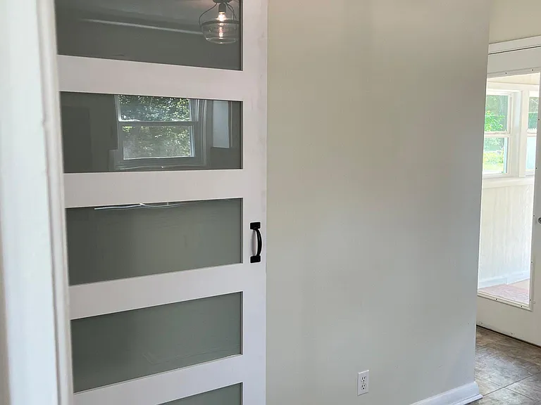 Pantry with barn door in kitchen