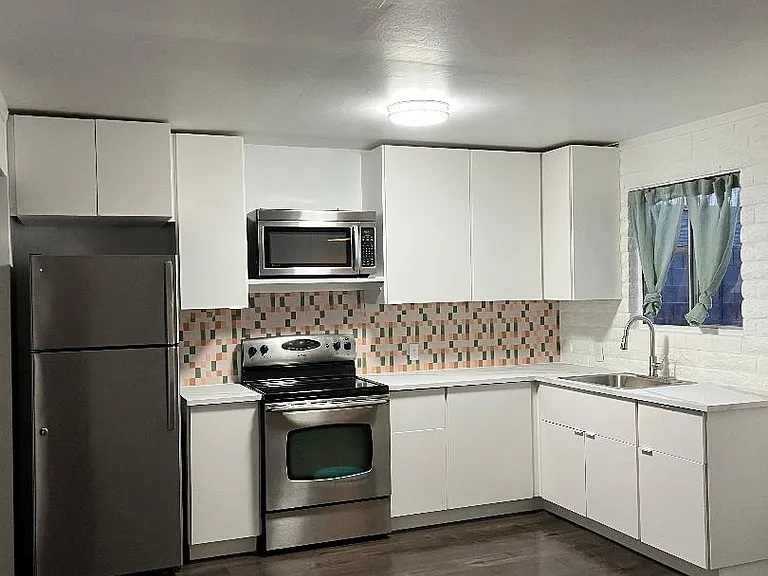 New cabinets, counters, sink, faucet, flooring.