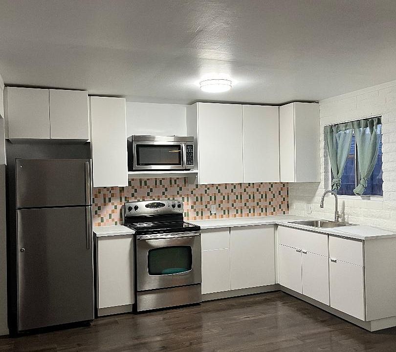 New cabinets, counters, sink, faucet, flooring.