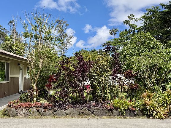 Private front yard hidden from road and parking area