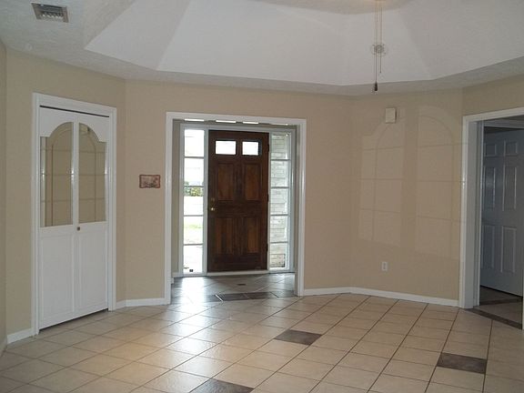 View of front door and wet bar