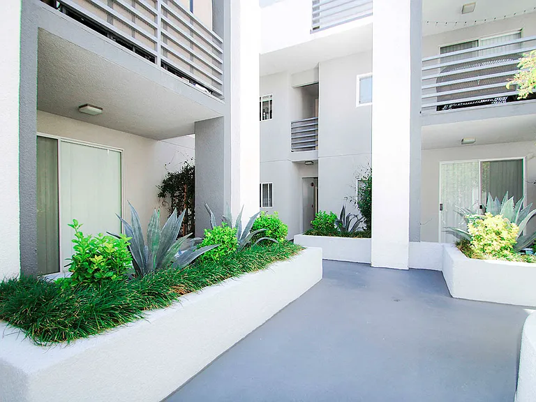 Lushly gardened interior courtyard.