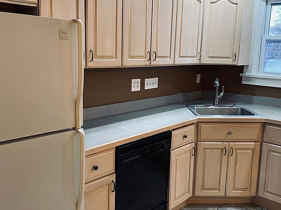 Dishwasher. Pull out cutting board. Tilt out sink drawer.