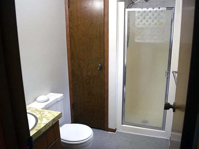 Master Bathroom with window and closet.