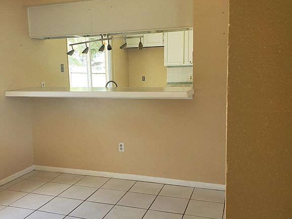 Part of dinning room with bar