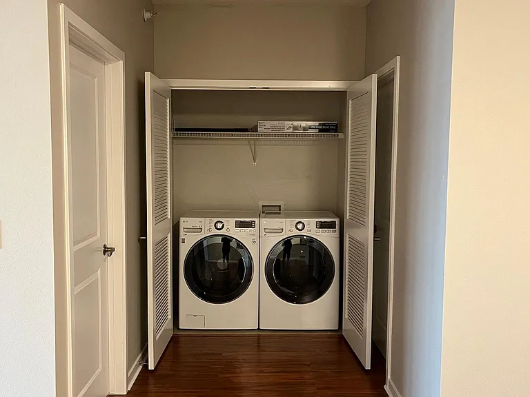 In-unit washer and dryer, between second bedroom and full bathroom