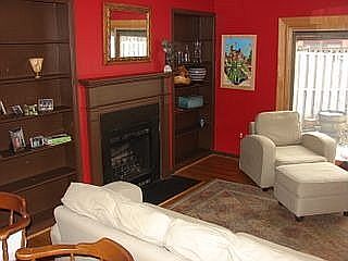living room with firplace and built in bookcases