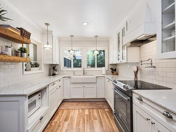 Your Dream Kitchen! Carerra Marble Counters, Farmhouse Sink and look at the cupbards!