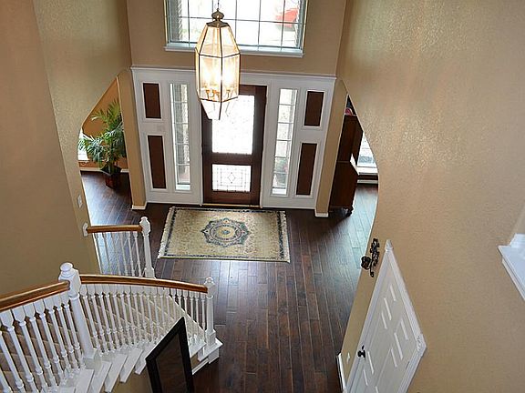 Sought after winding staircase recently updated with fresh paint, Handscraped Hardwood flooring.