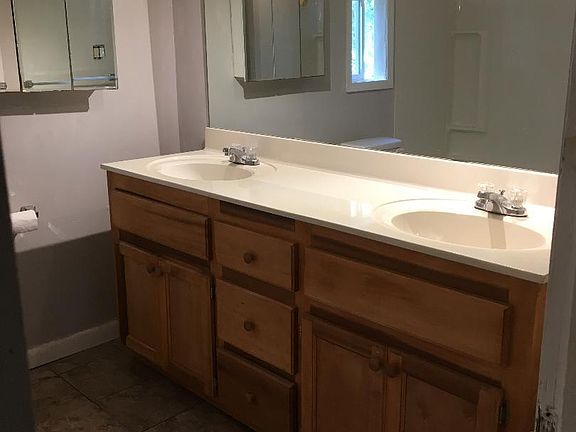 Double vanity in freshly painted gray bathroom