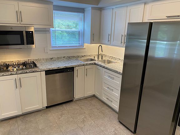 Kitchen with stainless steel appliances.