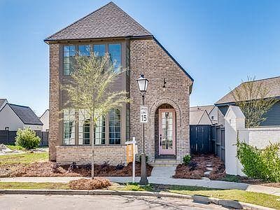 Front of home. (old stock photo does not show next-door neighbor's home recently built.)