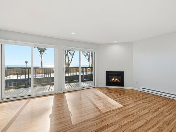 Cozy fireplace. Morning sun fills the living room.