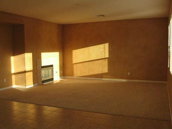 A family room with fireplace and great light