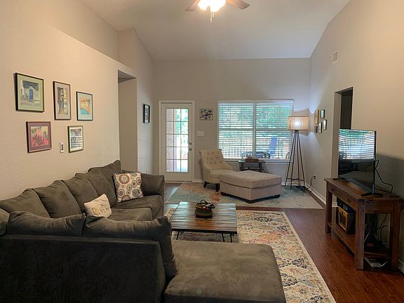 Main living area '12 x '18 overlooking porch and deck with an example of sample layout. (Furniture is not included in subject property.)
