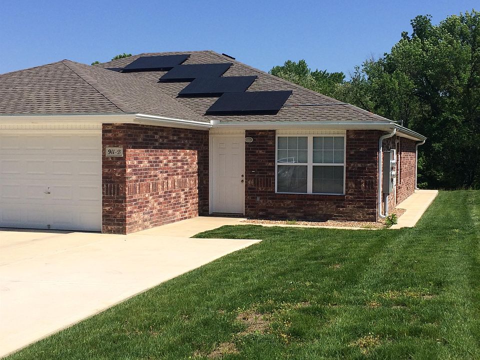 Outside is all brick with energy-efficient solar panels