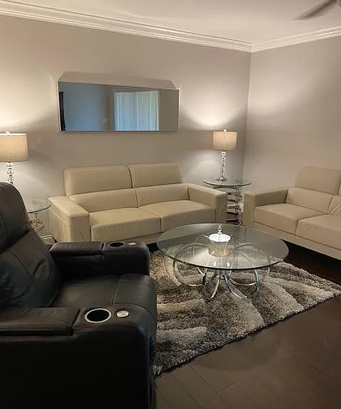 Living room with matching couch and loveseat and recliner