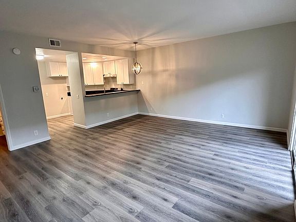 Entrance of unit to the left of kitchen