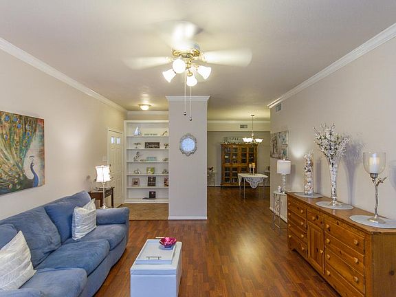 Open plan main living area, custom shelves at entry