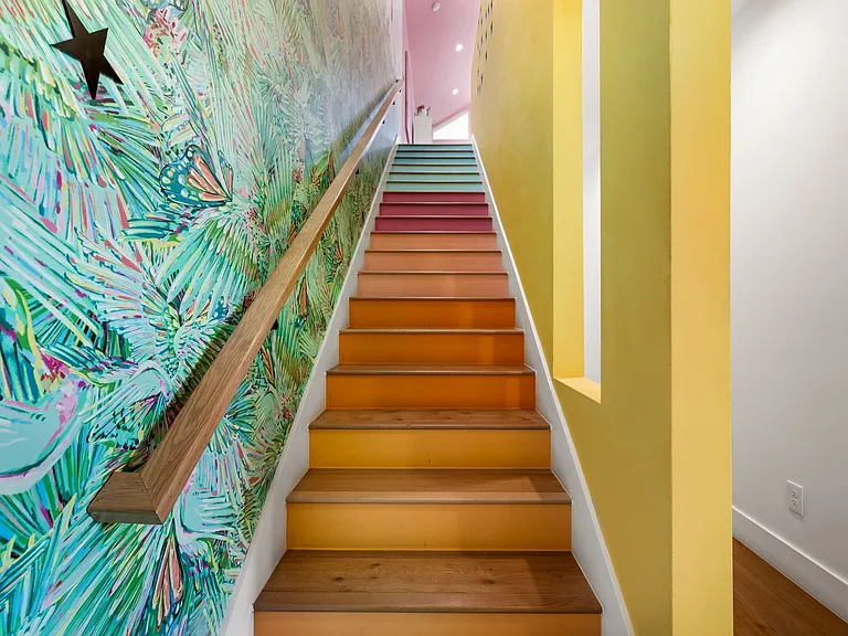 Staircase featuring wood-finish treads and risers with a vibrant gradient color application