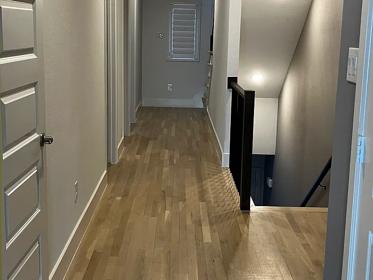 2nd level hallway: 3 bedrooms, 2 bathrooms, laundry + storage