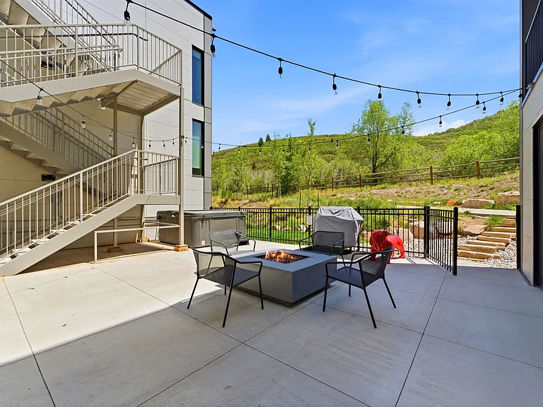 Patio with bistro lighting, gas firepit, BBQ, hot tub. Heated floor so you can enjoy all year round.